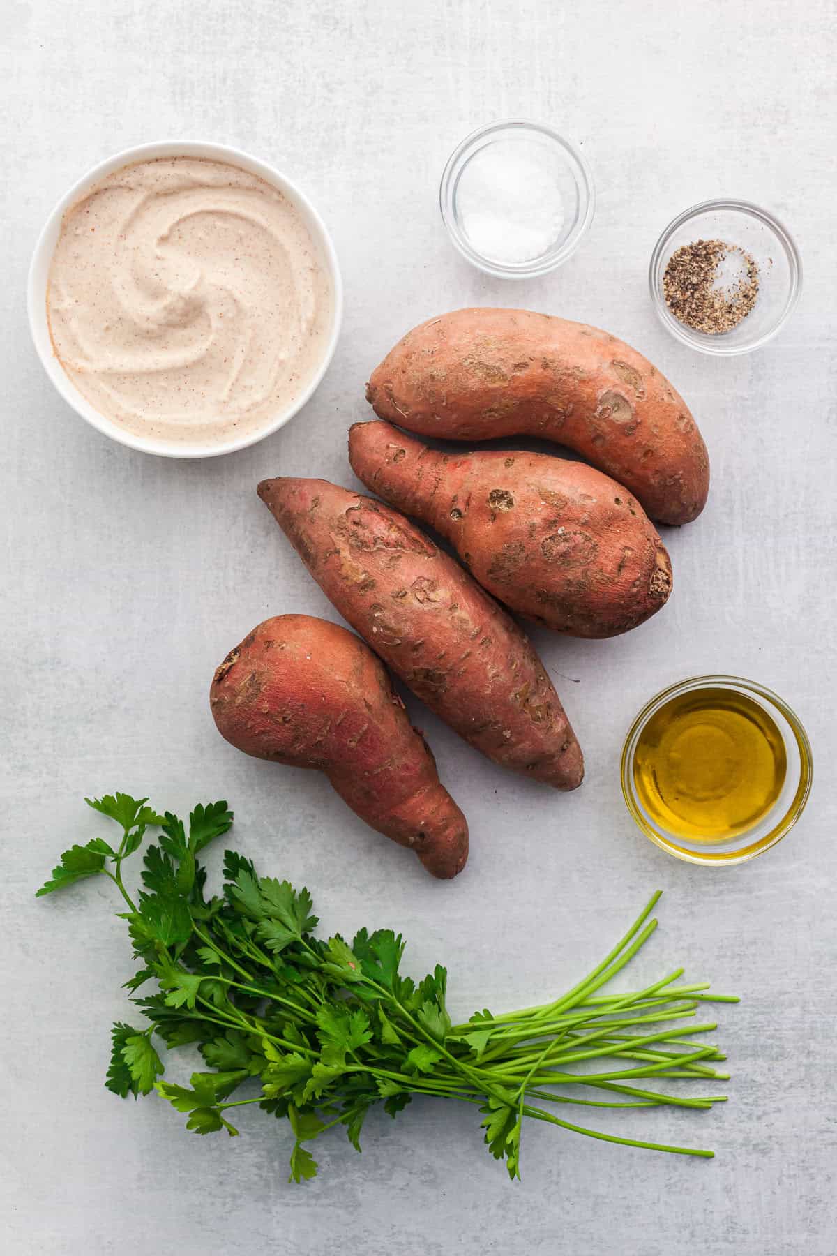 whole sweet potatoes, yogurt sauce, salt, pepper, olive oil and parsley 
